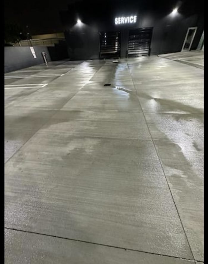 Auto dealership service drive washed corner to corner during overnight service