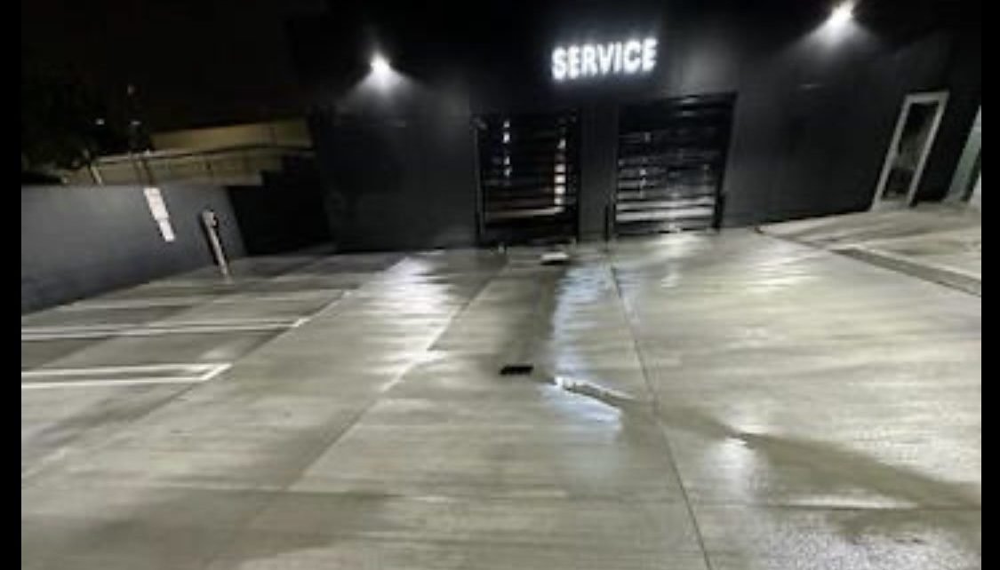 Auto dealership service drive washed corner to corner during overnight service