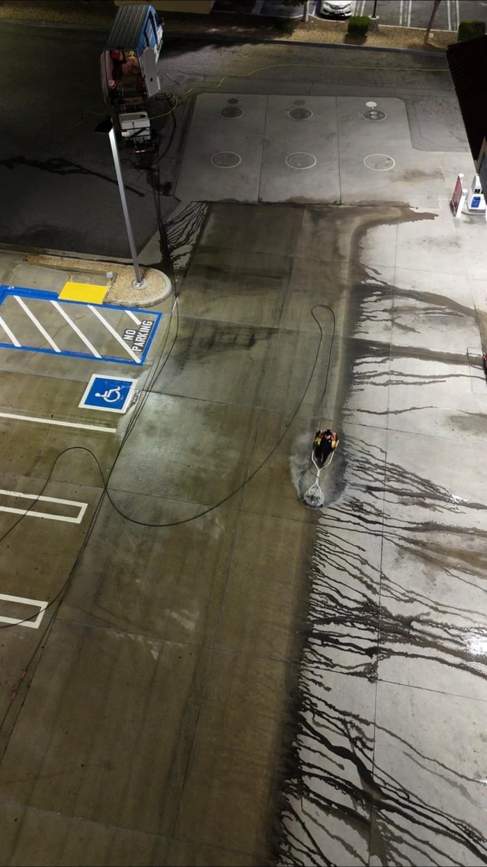 Elevated view of a commercial parking area during cleaning
